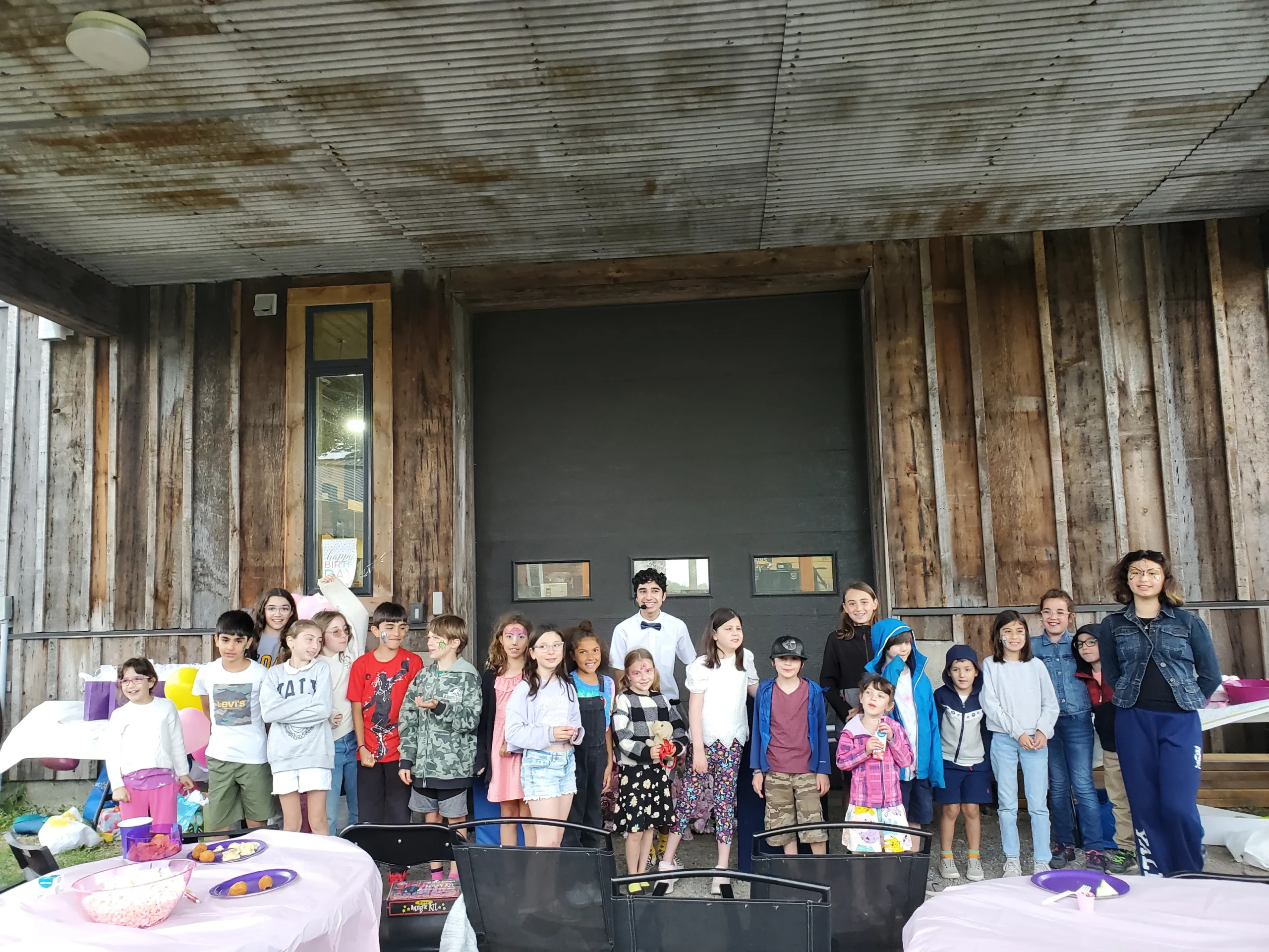 The Great Arjunia pictured with a large group of children he was performing magic for.